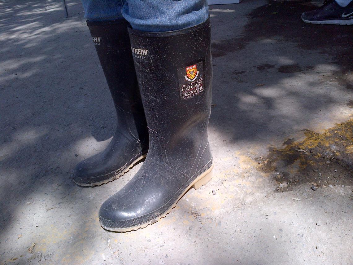 These boots were made for volunteering — passed along from Haskayne staff member Micheline Campanaro to a bootless volunteer.