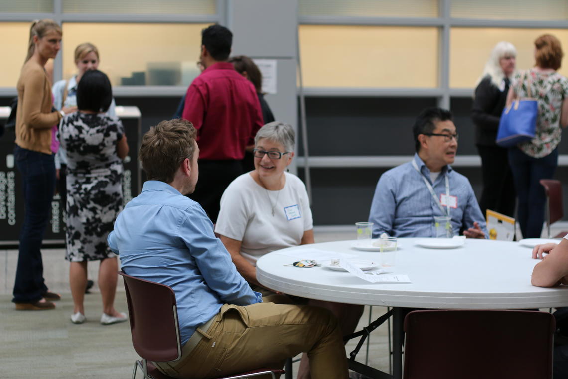 Community health agency members, AHS professionals, and University of Calgary representatives discuss strategies at a town hall for inner city groups hosted by the Cumming School of Medicine, and supported by the O’Brien Institute for Public Health and W21C. 