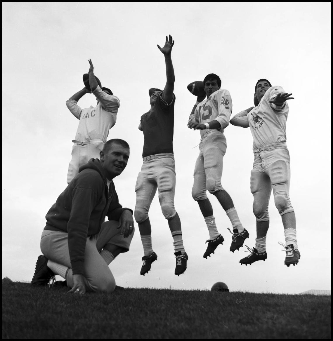 Coach Kadatz evaluates four players for the quarterback role in the 1960s.