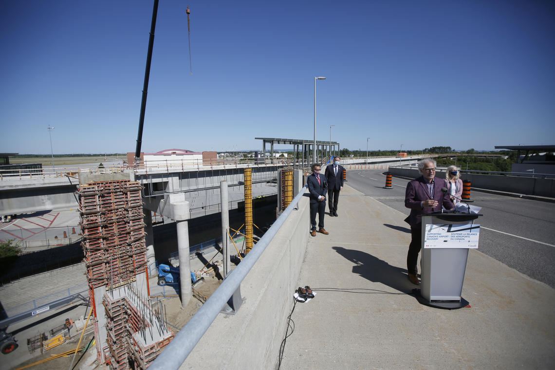 Construction of the future LRT line is visible to the left at the Ottawa MacDonald-Cartier International Airport in June 2021. 