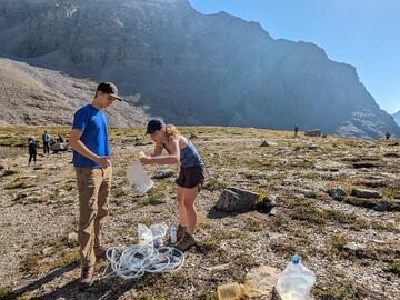 Colleen and Cordelius prepare equipment at the site. 