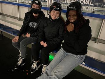 Three skaters at Oval After Dark
