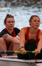Claire O'Brien [left] and Eliza Dawson [right] row for UCalgary at the first Dino's Sprints Regatta race since COVID restrictions were lifted in September 2021. 