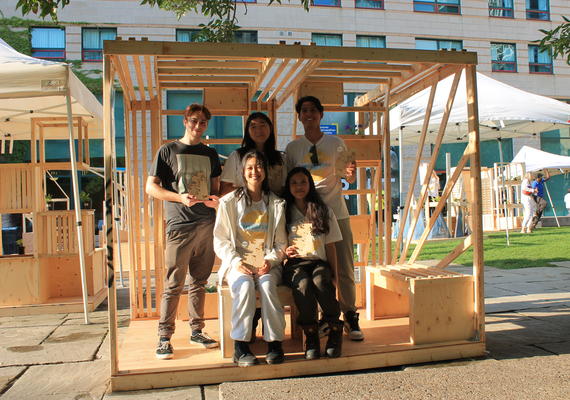 Reyvileen Soriano, front row, right, poses for a photo with team members inside their Ascend Garden Pavilion.