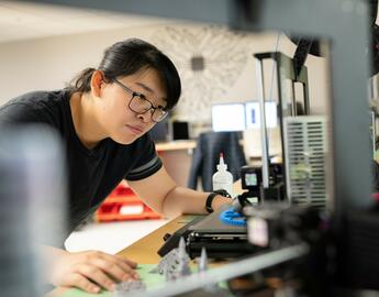 student using the 3D printer