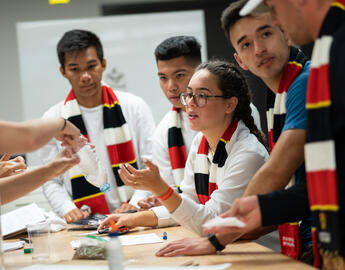 undergraduate students with their scarves